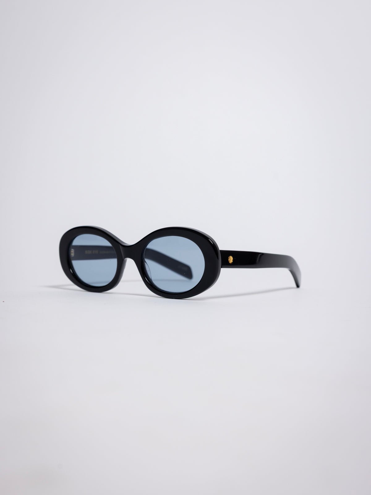 141 Waverly Pl, Side Eye oval sunglasses, black acetate frame with blue tinted lenses, sideeye [variant:Black / Blue]