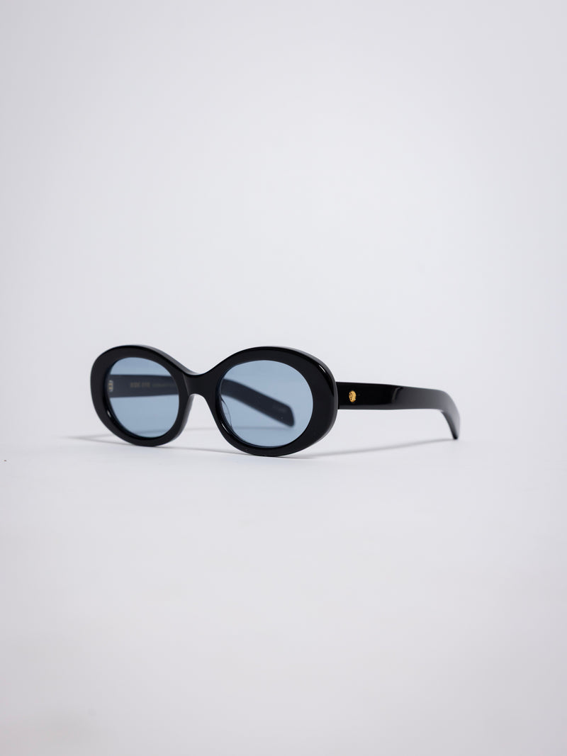 141 Waverly Pl, Side Eye oval sunglasses, black acetate frame with blue tinted lenses, sideeye [variant:Black / Blue]
