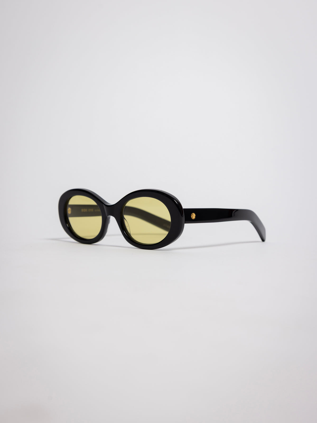 141 Waverly Pl, Side Eye oval sunglasses, black acetate frame with yellow tinted lenses, sideeye [variant:Black / Yellow]