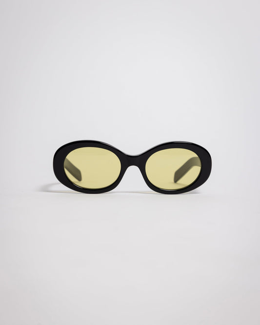 141 Waverly Pl, Side Eye oval sunglasses with black acetate frame and yellow tinted lenses [variant:Black / Yellow]